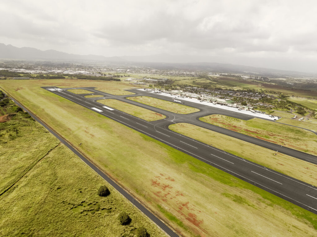 Aerial view of airport runway and surrounding airspace — FAA written exam preparation includes airspace classification and airport operations