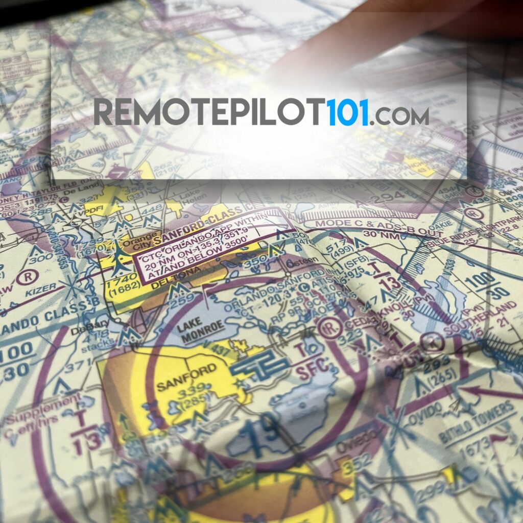 Finger pointing at Sanford Class C airspace on a sectional chart during private pilot navigation training.